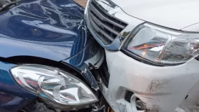 Two cars have been in a car accident.