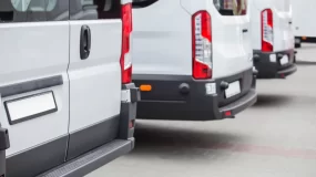 white commercial vans lined up.