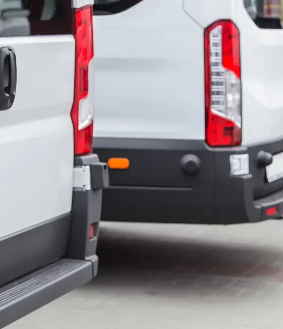 white commercial vans lined up.