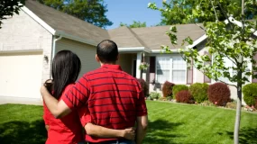 Couple looking at a house.