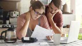 Worried couple about the dangers of going without liability insurance.