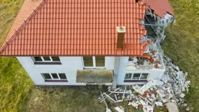 Car crashing into a house