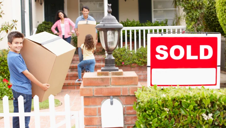 Smiling family moves into their new home in Macon, GA.