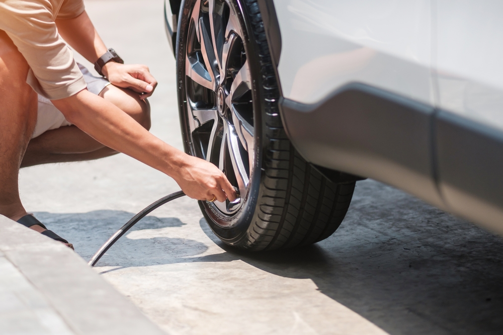 person inflating tires