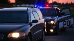 Police car pulled up behind another car - car insurance in Georgia